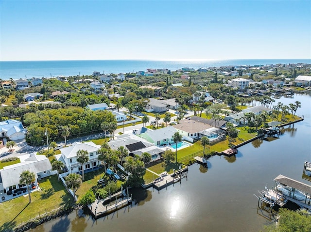 bird's eye view with a water view and a residential view