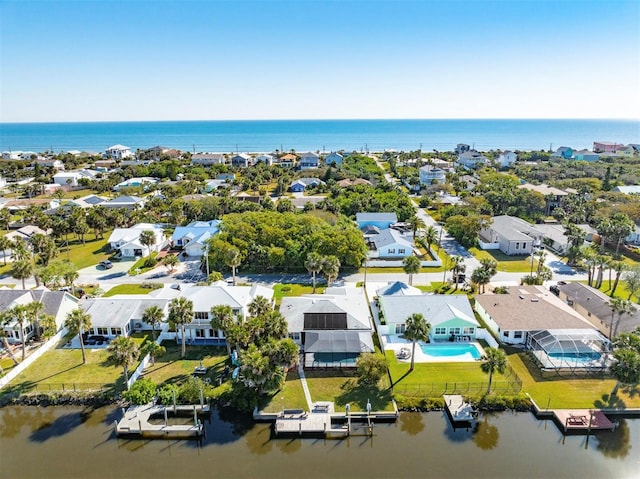 aerial view with a residential view and a water view