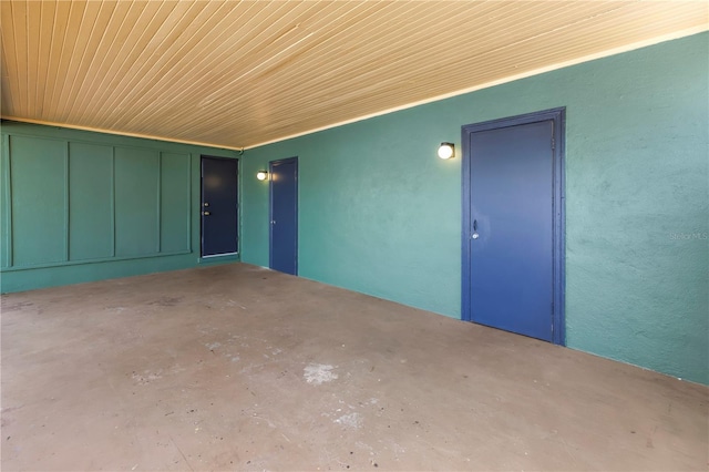 view of exterior entry featuring a patio area