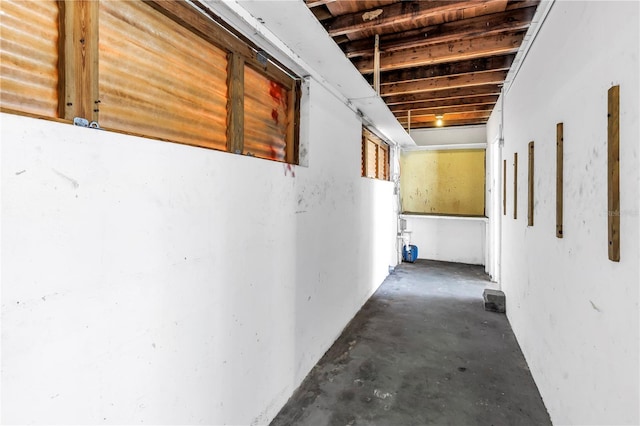hall featuring concrete floors