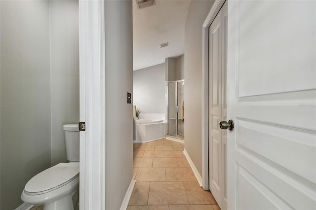 6006 Chellas Ct, Lutz, FL 33558 - full bath featuring a garden tub, visible vents, tile patterned flooring, a shower stall, and toilet