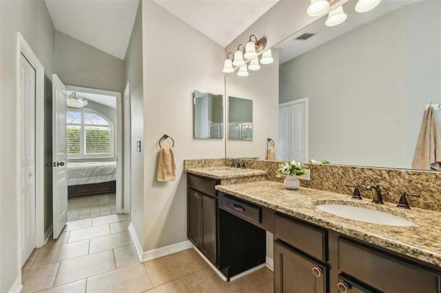6006 Chellas Ct, Lutz, FL 33558 - full bath with a sink, vaulted ceiling, double vanity, and visible vents