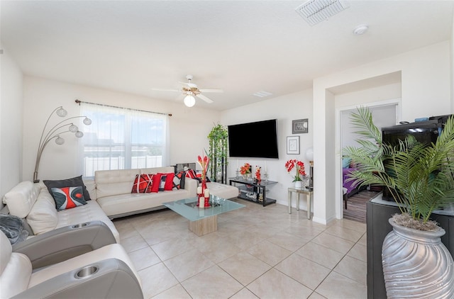 947 Serchio St, Haines City, FL 33844 - living area featuring visible vents, ceiling fan, light tile patterned floors, and baseboards