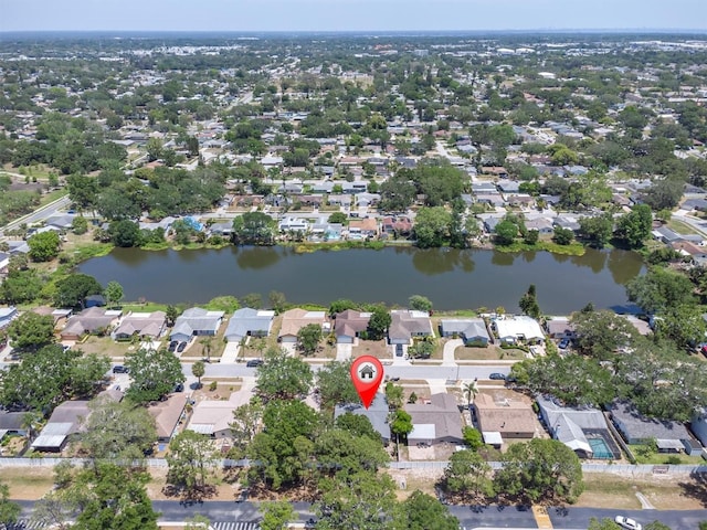 drone / aerial view with a water view and a residential view