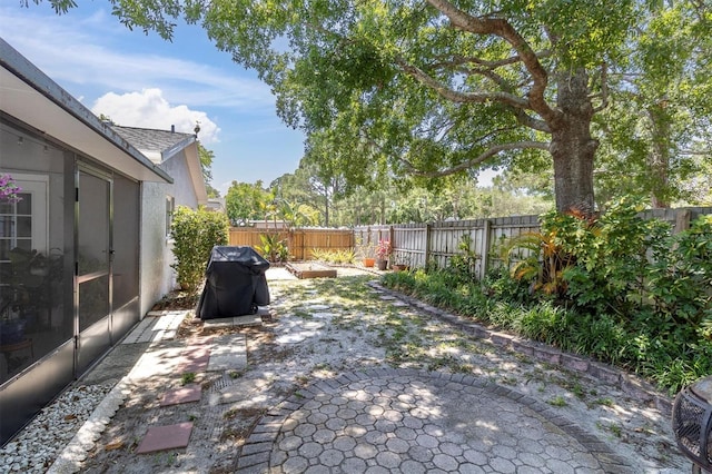view of patio featuring a fenced backyard and grilling area