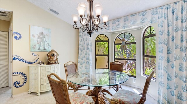 6148 Bonaventure Ct, Sarasota, FL 34243 - dining area with lofted ceiling, a chandelier, visible vents, and light tile patterned floors