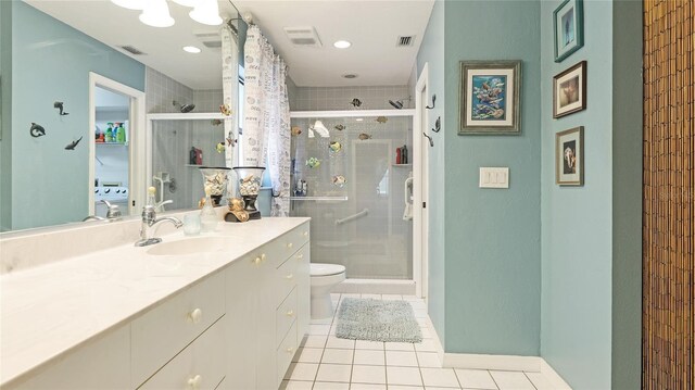 6148 Bonaventure Ct, Sarasota, FL 34243 - bathroom featuring visible vents, tile patterned flooring, a shower stall, and toilet
