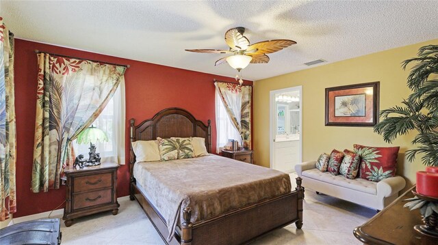 6148 Bonaventure Ct, Sarasota, FL 34243 - bedroom featuring a textured ceiling, visible vents, a ceiling fan, and connected bathroom