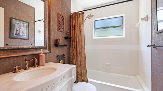6148 Bonaventure Ct, Sarasota, FL 34243 - bathroom featuring vanity, shower / bathtub combination with curtain, and toilet