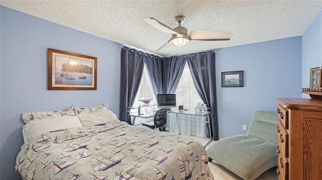 6148 Bonaventure Ct, Sarasota, FL 34243 - bedroom with a ceiling fan and a textured ceiling