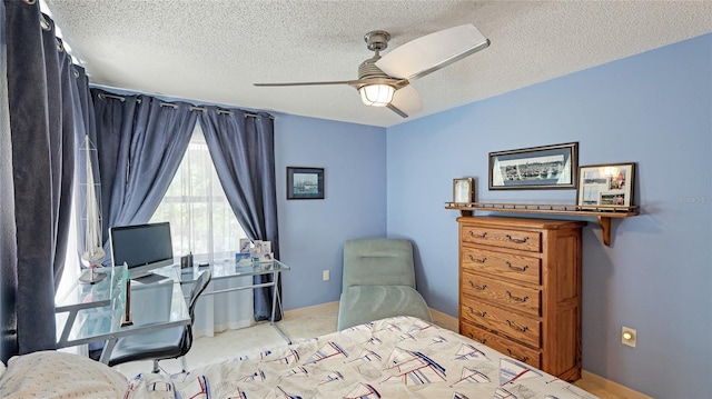 6148 Bonaventure Ct, Sarasota, FL 34243 - bedroom featuring baseboards, a ceiling fan, a textured ceiling, and carpet