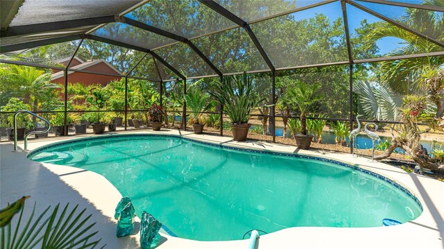 6148 Bonaventure Ct, Sarasota, FL 34243 - outdoor pool featuring a patio area and glass enclosure