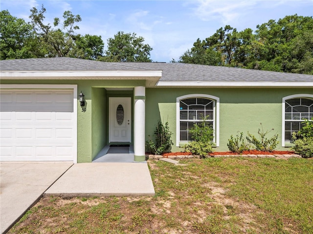 30 N Kaufman Ter, Inverness, FL 34453 - ranch-style house with a garage, stucco siding, concrete driveway, and a front lawn