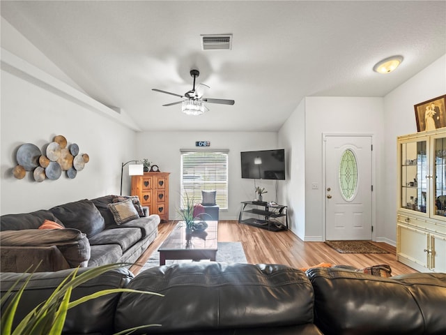 30 N Kaufman Ter, Inverness, FL 34453 - living area featuring ceiling fan, baseboards, wood finished floors, lofted ceiling, and visible vents