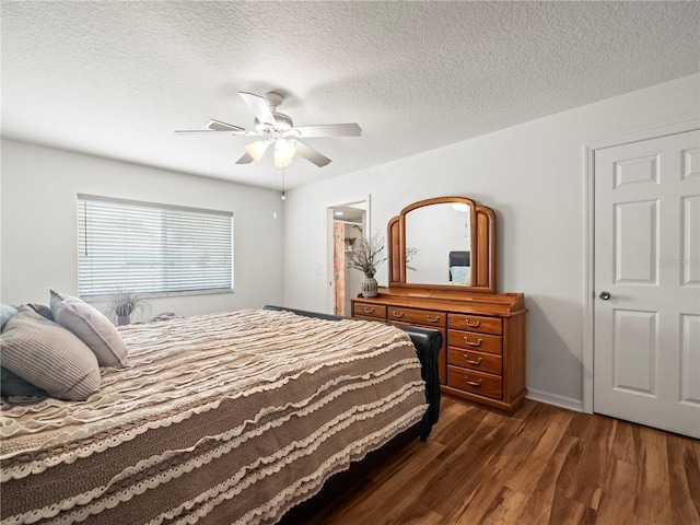 30 N Kaufman Ter, Inverness, FL 34453 - bedroom featuring baseboards, a textured ceiling, dark wood-style flooring, and ceiling fan