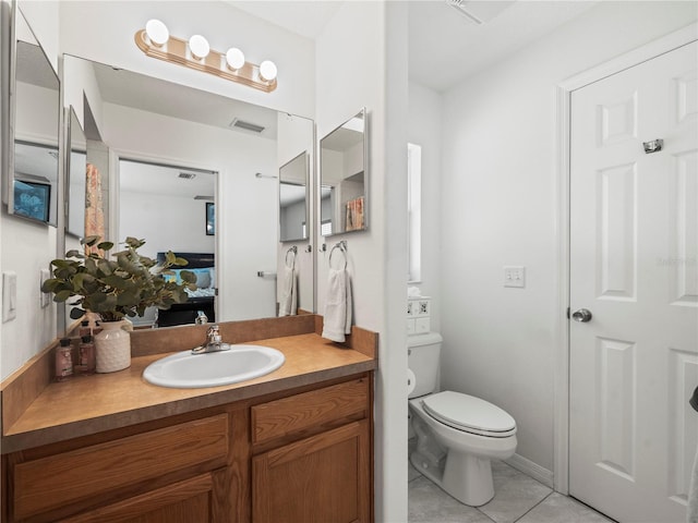 30 N Kaufman Ter, Inverness, FL 34453 - bathroom featuring visible vents, tile patterned flooring, vanity, toilet, and ensuite bath
