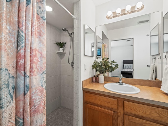 30 N Kaufman Ter, Inverness, FL 34453 - bathroom with visible vents, ensuite bathroom, a tile shower, and vanity
