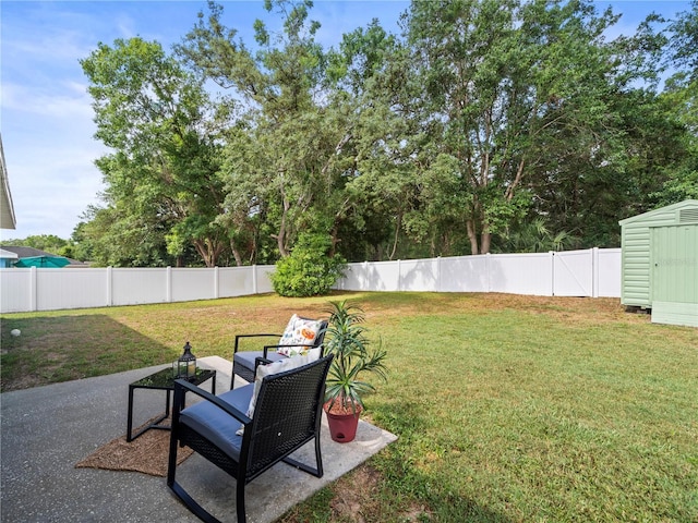30 N Kaufman Ter, Inverness, FL 34453 - view of yard featuring a storage shed, an outdoor structure, a fenced backyard, and a patio area