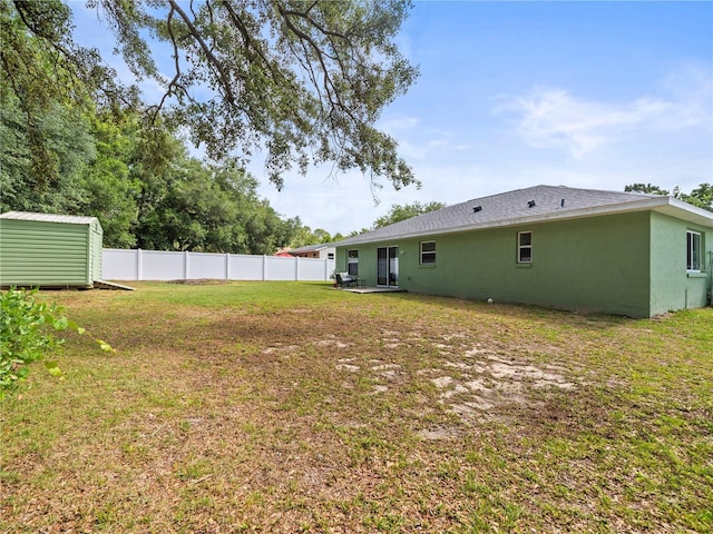 30 N Kaufman Ter, Inverness, FL 34453 - view of yard featuring fence, an outbuilding, and a shed