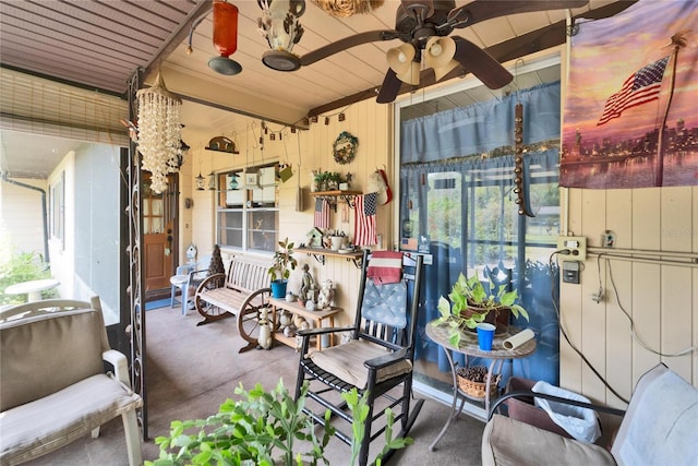 sunroom / solarium with ceiling fan and a healthy amount of sunlight