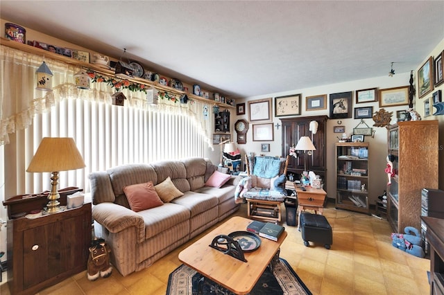 living room featuring tile patterned floors and plenty of natural light