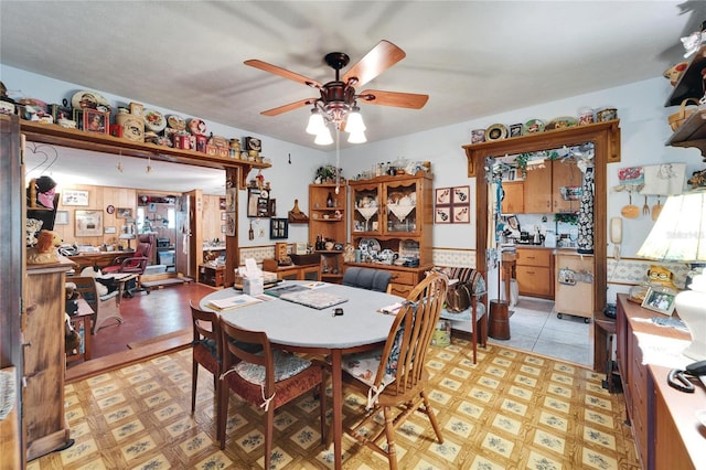 dining area featuring light floors and ceiling fan