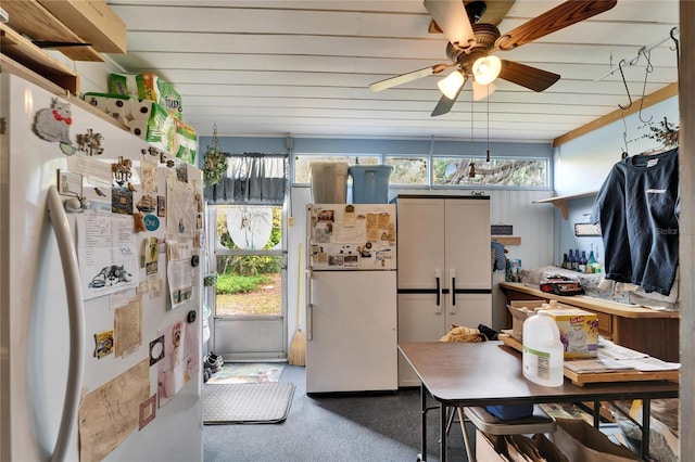kitchen featuring freestanding refrigerator and a ceiling fan