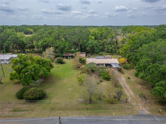 drone / aerial view featuring a forest view