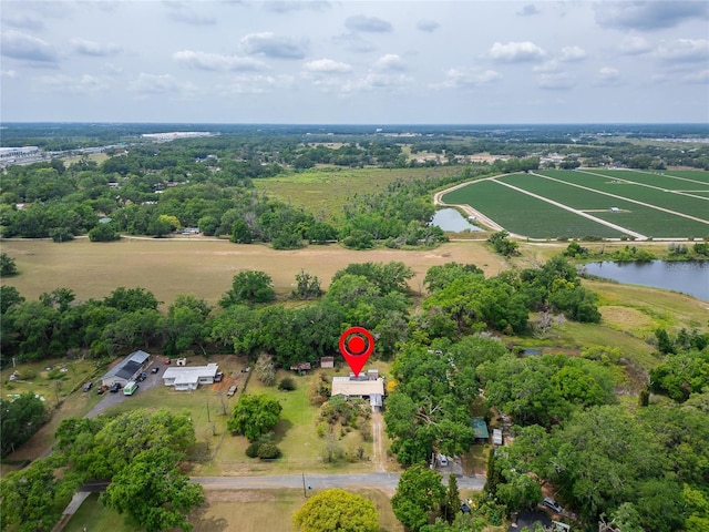 birds eye view of property with a water view and a rural view