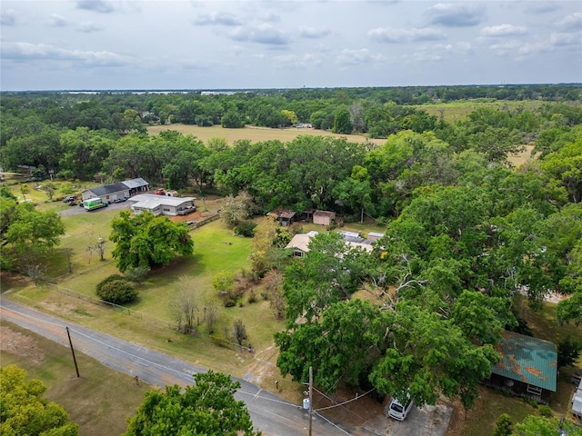 aerial view featuring a wooded view
