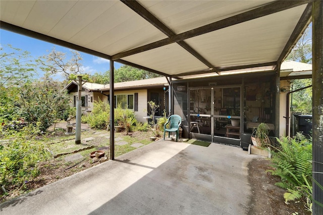 view of patio / terrace with a sunroom