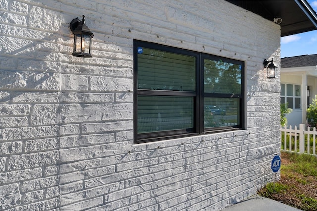 view of home's exterior with fence