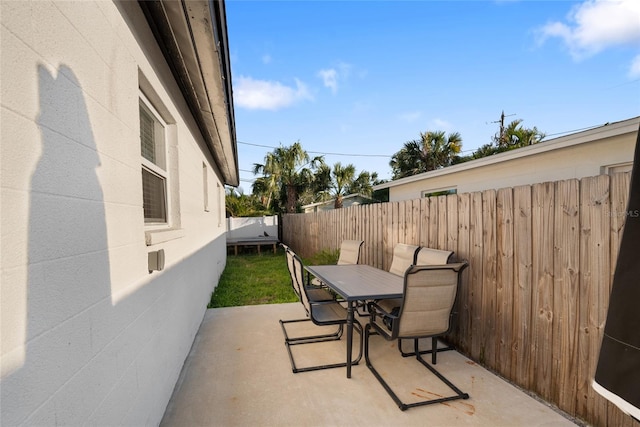 view of patio / terrace with a fenced backyard and outdoor dining area