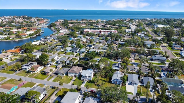 drone / aerial view with a residential view and a water view
