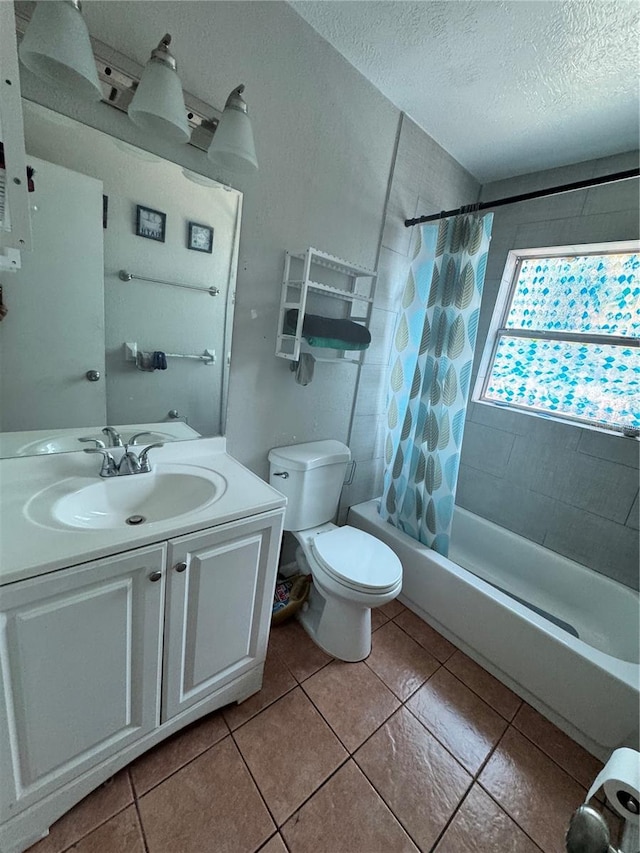 1407 College Park Ln, Tampa, FL 33612 - bathroom with tile patterned floors, a textured ceiling, toilet, shower / tub combo, and vanity