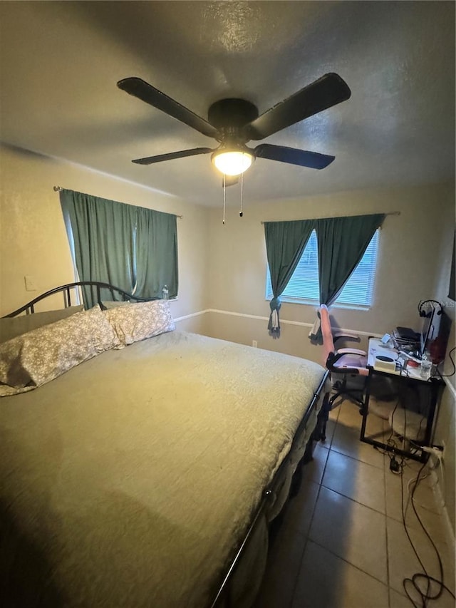 1407 College Park Ln, Tampa, FL 33612 - tiled bedroom featuring a ceiling fan