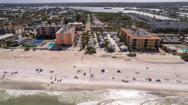 birds eye view of property featuring a view of the beach and a water view