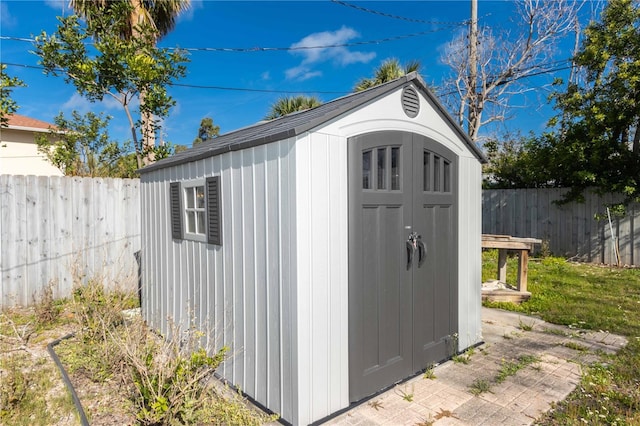 view of shed featuring a fenced backyard