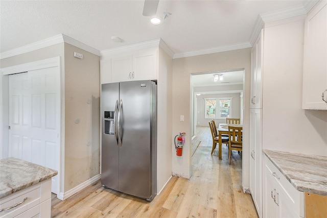 kitchen with baseboards, white cabinets, stainless steel fridge with ice dispenser, and light wood-style flooring