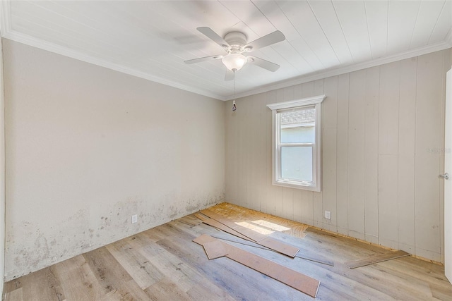 unfurnished room with crown molding, ceiling fan, and wood finished floors