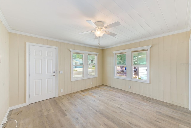 unfurnished room featuring ornamental molding, ceiling fan, and wood finished floors