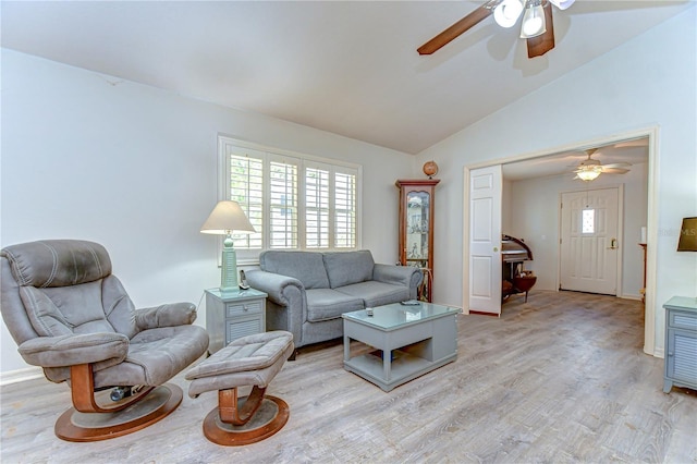 5906 Greenbriar Ct, Zephyrhills, FL 33542 - living room featuring ceiling fan, light wood-style floors, vaulted ceiling, and baseboards