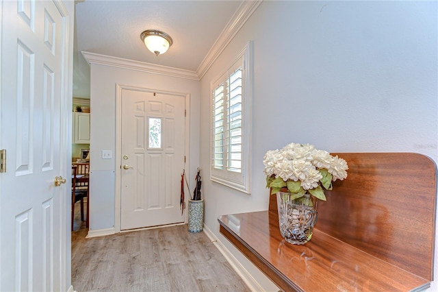 5906 Greenbriar Ct, Zephyrhills, FL 33542 - entryway with light wood-style flooring, baseboards, and crown molding