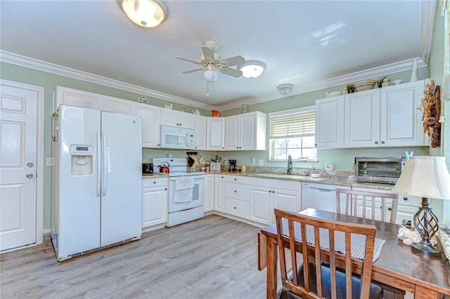 5906 Greenbriar Ct, Zephyrhills, FL 33542 - kitchen with crown molding, light wood-style floors, ceiling fan, white appliances, and a sink