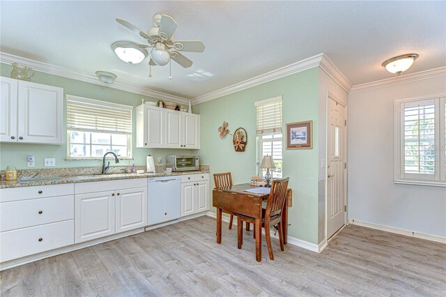5906 Greenbriar Ct, Zephyrhills, FL 33542 - kitchen with a toaster, light wood-style flooring, a ceiling fan, white dishwasher, and a sink