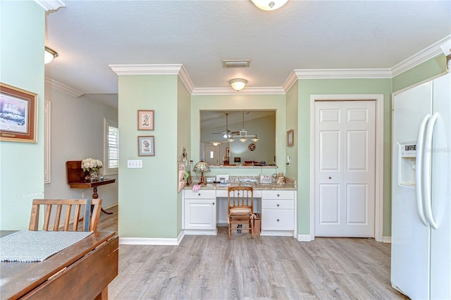 5906 Greenbriar Ct, Zephyrhills, FL 33542 - interior space featuring light wood-style flooring, ornamental molding, visible vents, a ceiling fan, and baseboards