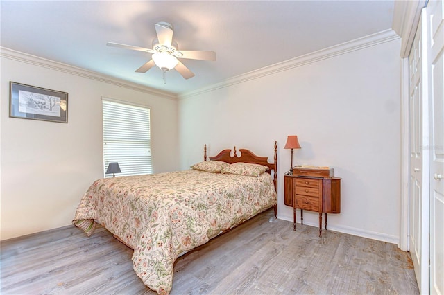 5906 Greenbriar Ct, Zephyrhills, FL 33542 - bedroom with ornamental molding, a ceiling fan, and wood finished floors