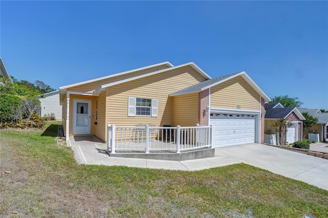 5906 Greenbriar Ct, Zephyrhills, FL 33542 - ranch-style home with a front yard, driveway, and a garage
