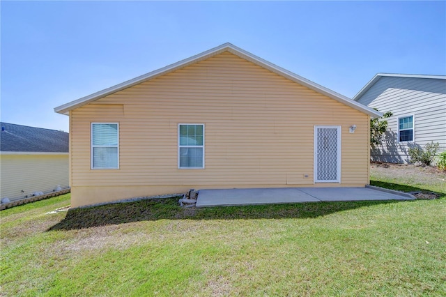 5906 Greenbriar Ct, Zephyrhills, FL 33542 - rear view of house featuring a patio and a yard
