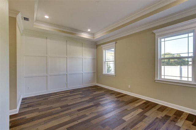 unfurnished room with dark wood-style flooring, ornamental molding, and a wealth of natural light